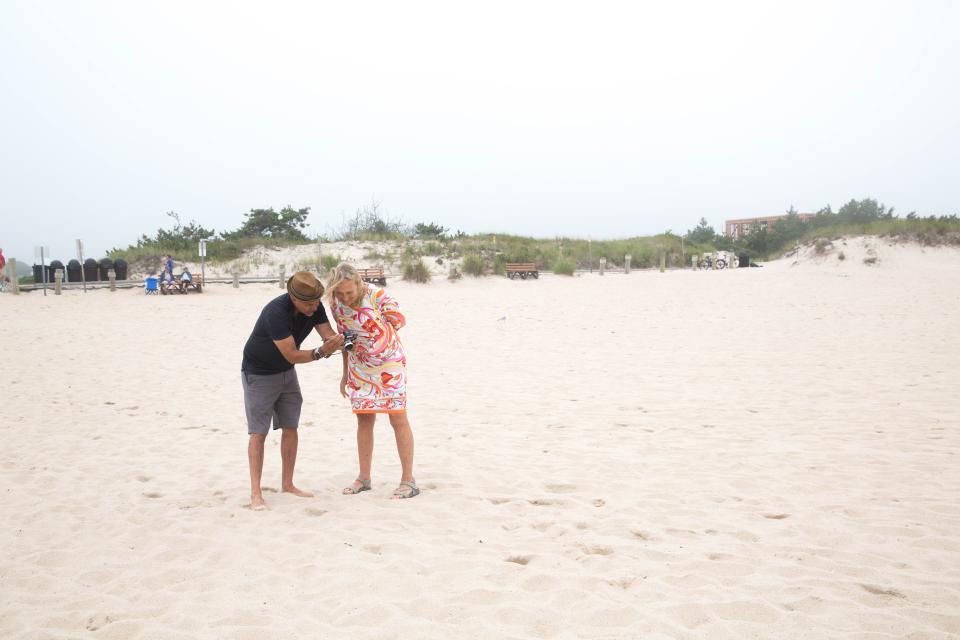 A male and female on the beach.