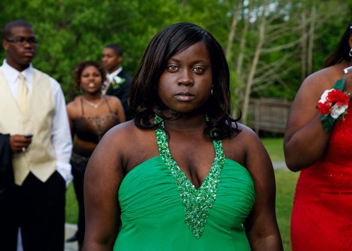 A picture of woman at an outside party.