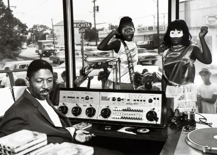 People listening to music at a music store.