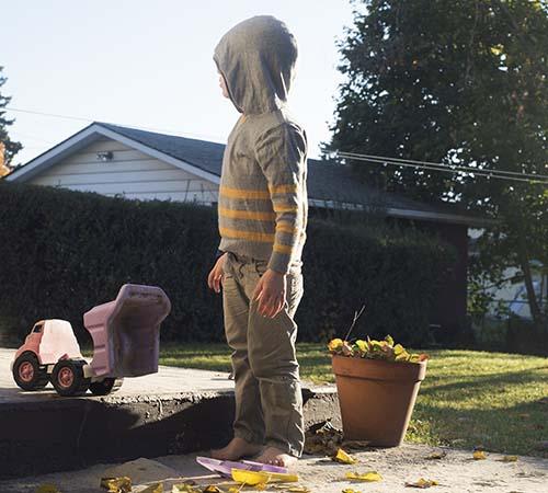 A kid playing outside.