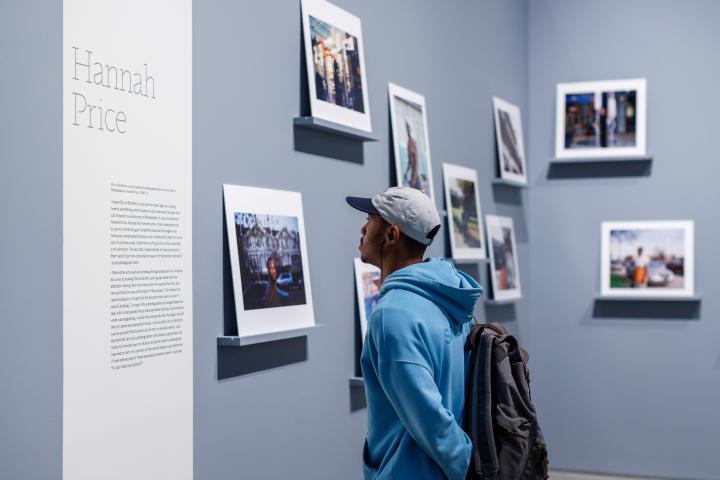 A young man reading the information for a Hannah Price ICP exhibit. 