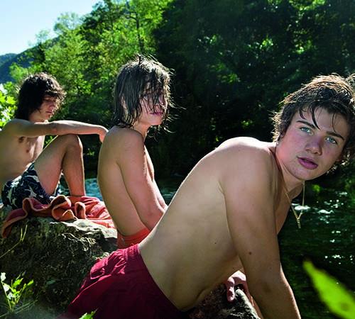 Three kids playing outside.