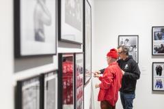 Two people looking at an art piece.